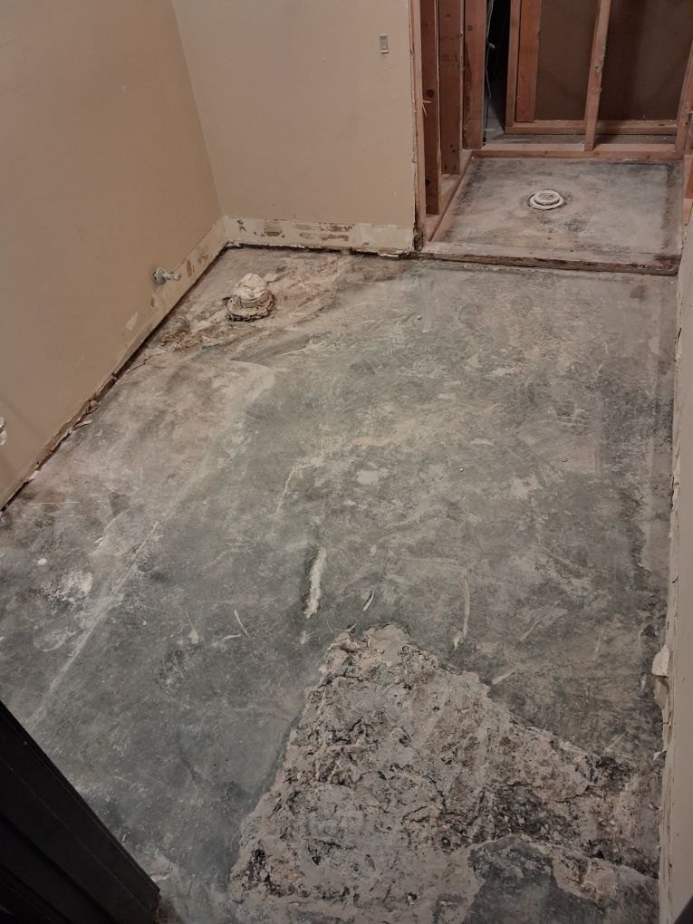Bath floor cleared to slab