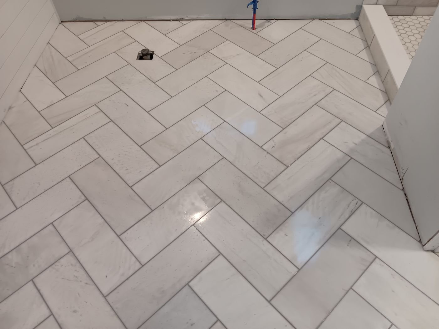 White herringbone bath floor