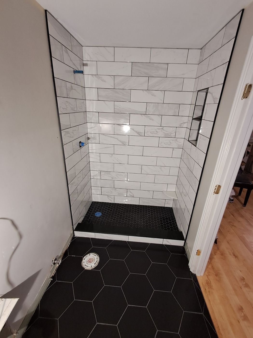 Black hex shower floor, glass enclosure